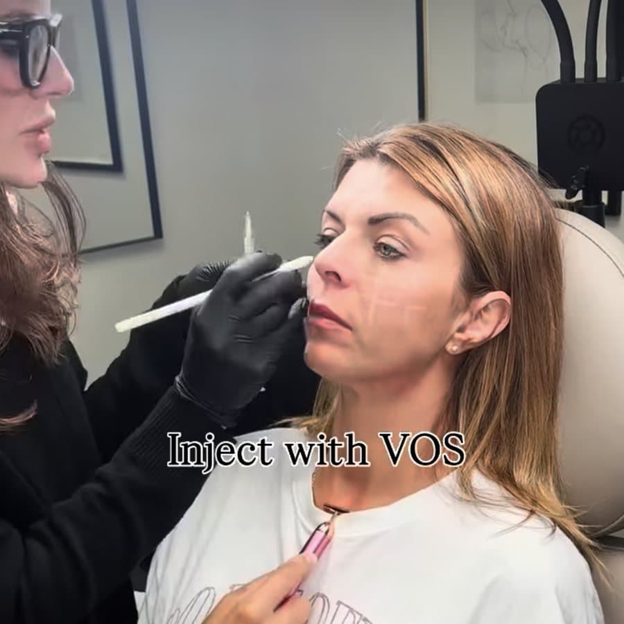 Jocelyn mapping a client before treatment, captioned Inject with VOS